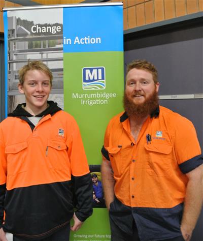 A work experience and MI employee standing together